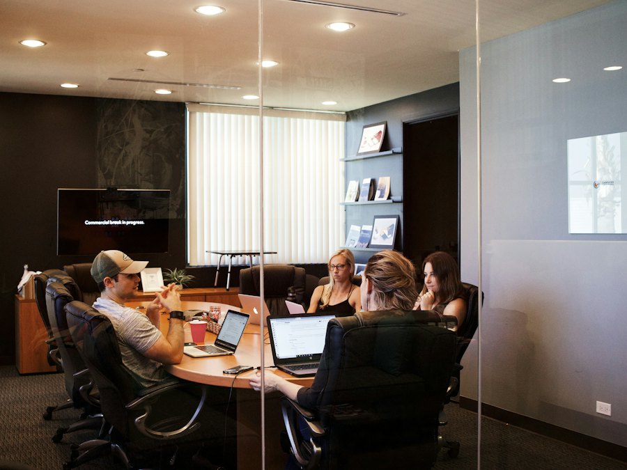 A finance team at a table working through figures