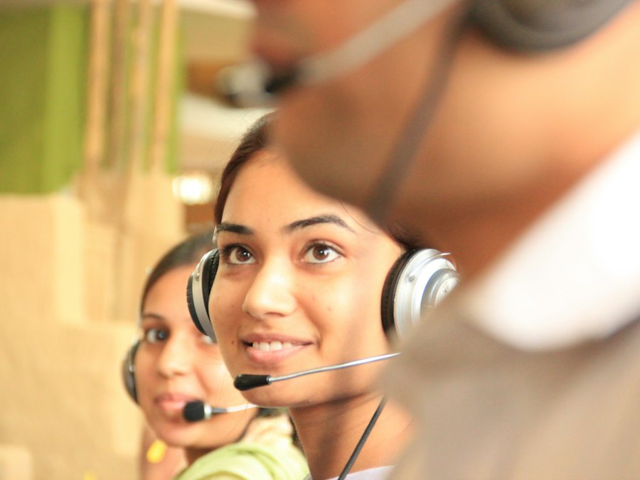 Two agents wearing headsets in a contact center